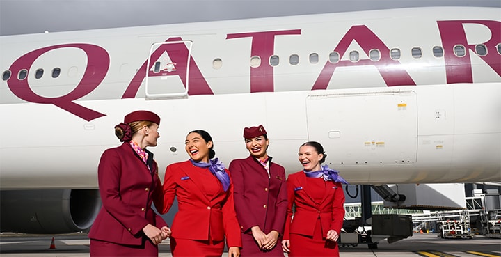 Virgin Australia and Qatar Airways cabin crew standing outside of aircraft